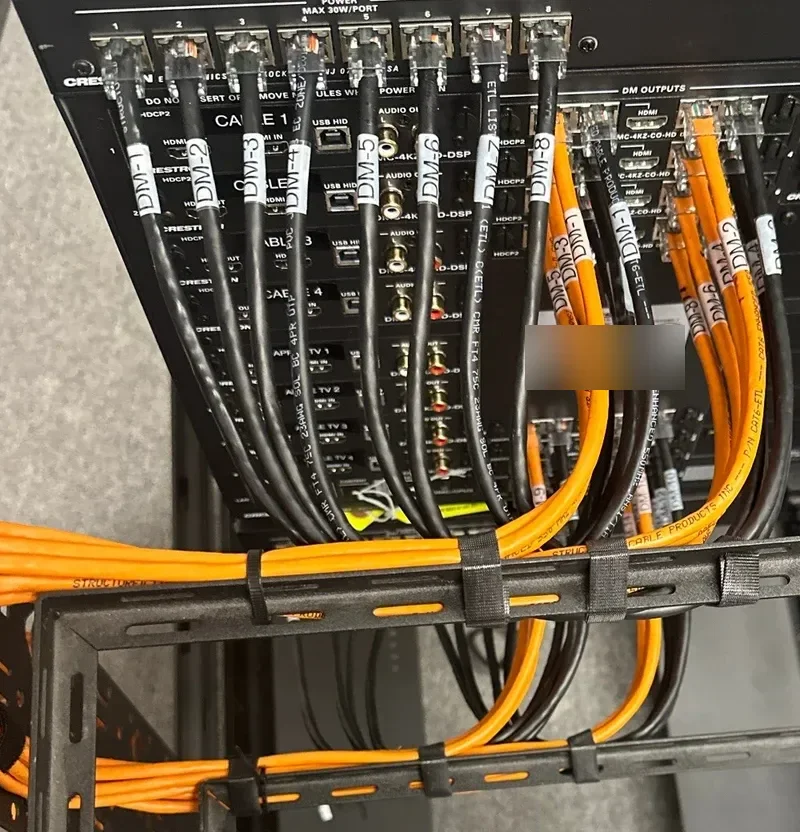 Crestron DigitalMedia switcher with routed and labeled cabling