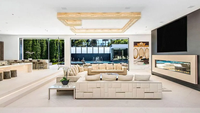 Ketra-lit living room with recessed ceiling lighting and decorative fixtures