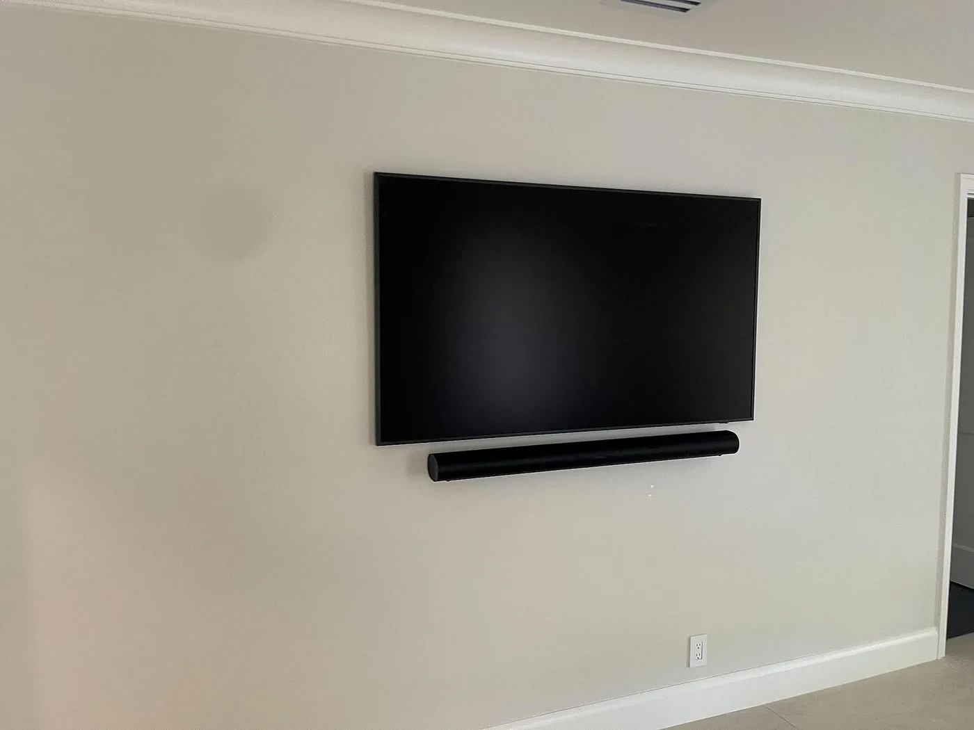 Flush-mounted display and soundbar in a South Florida home