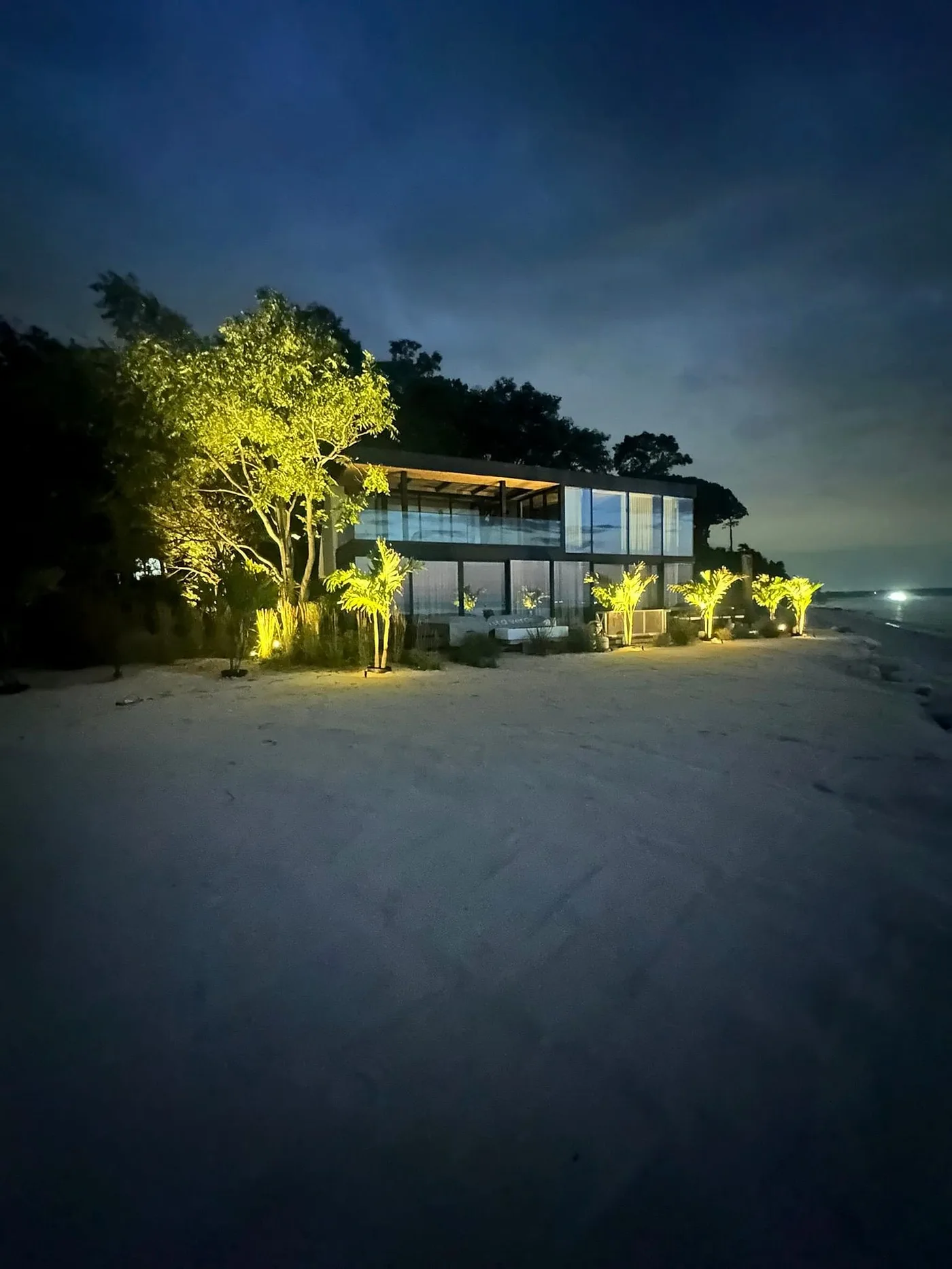 Landscape uplighting around a waterfront property