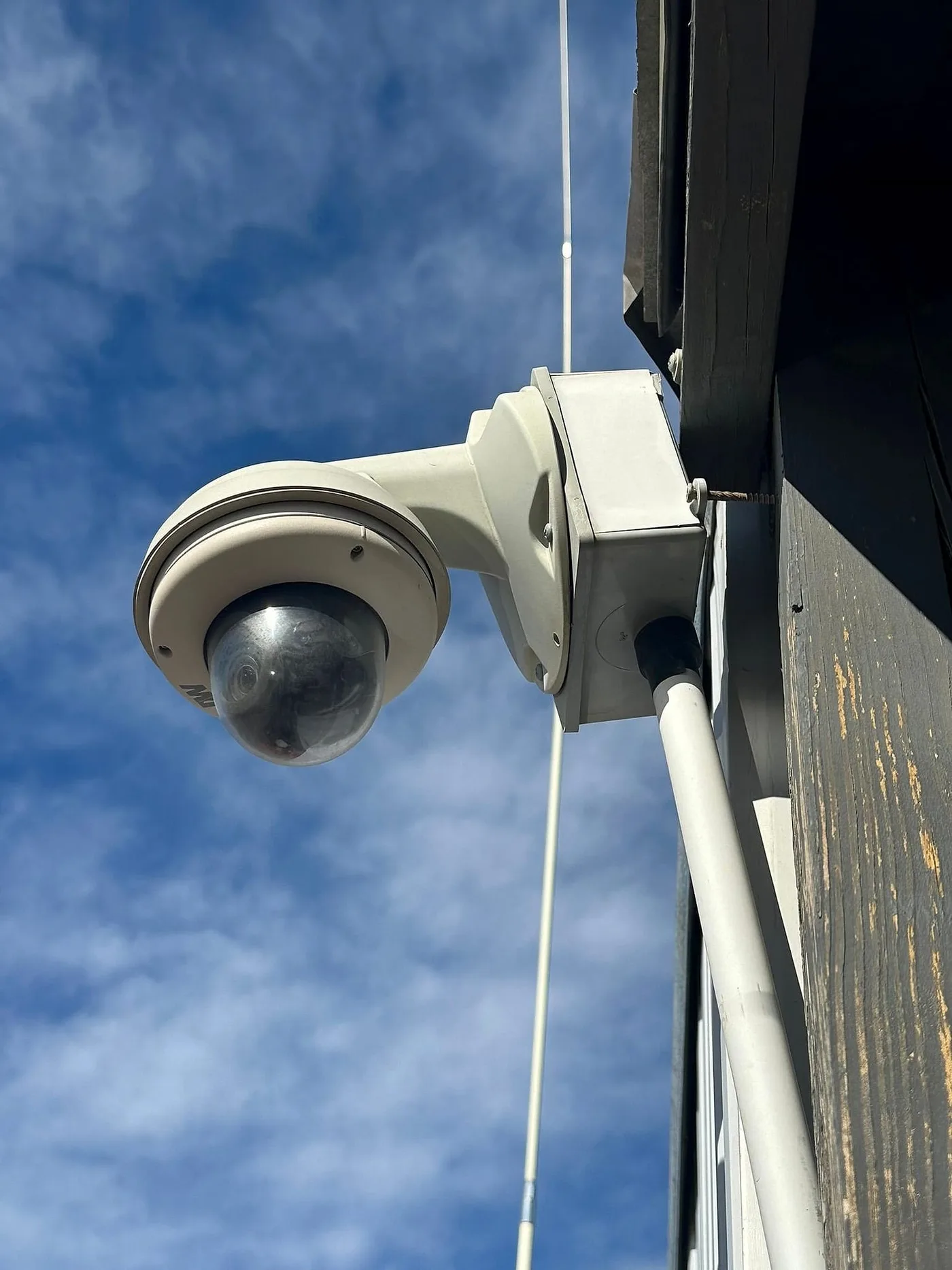 Outdoor dome camera mounted under an eave