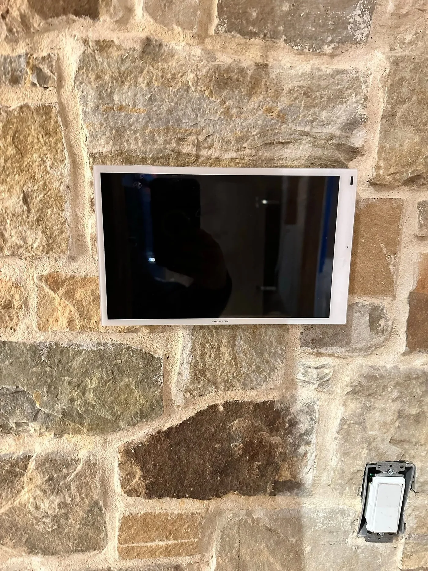 Control panel recessed into a stone wall