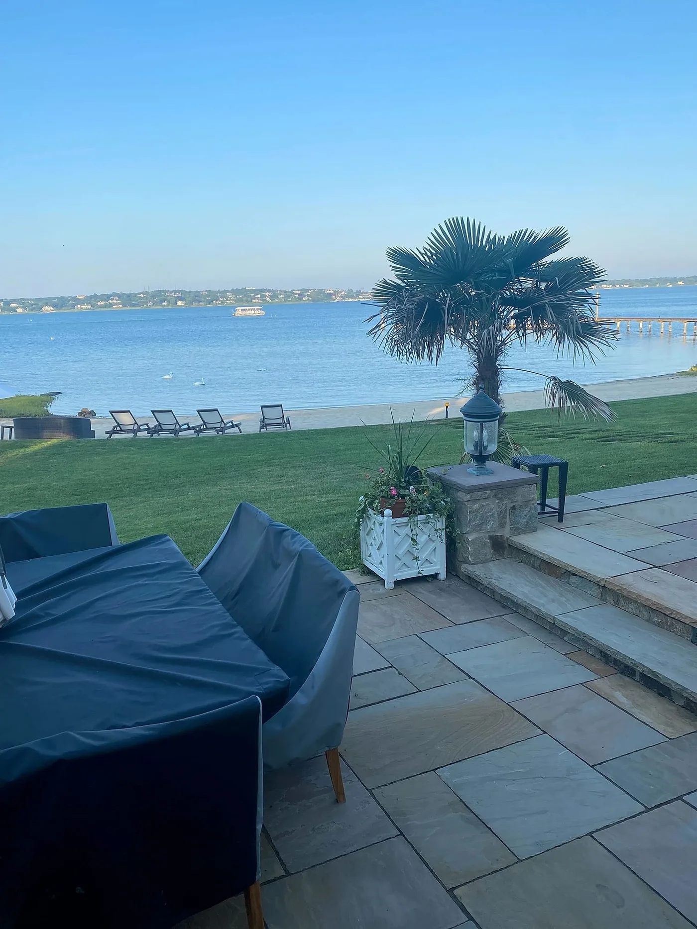 Outdoor living area at a Hamptons waterfront residence