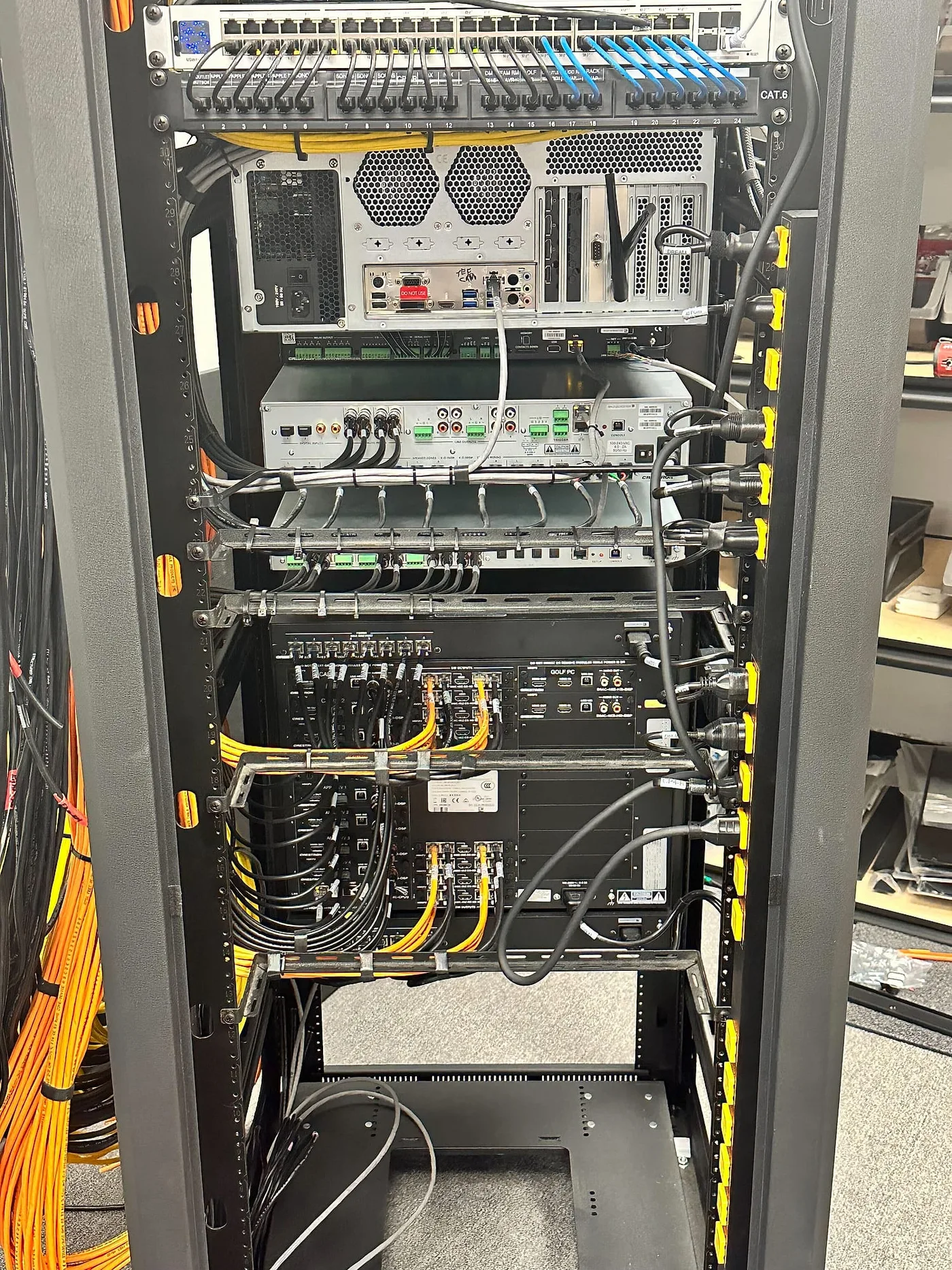 Dressed rear rack cabling — representative Limitless AV work, specific property not confirmed