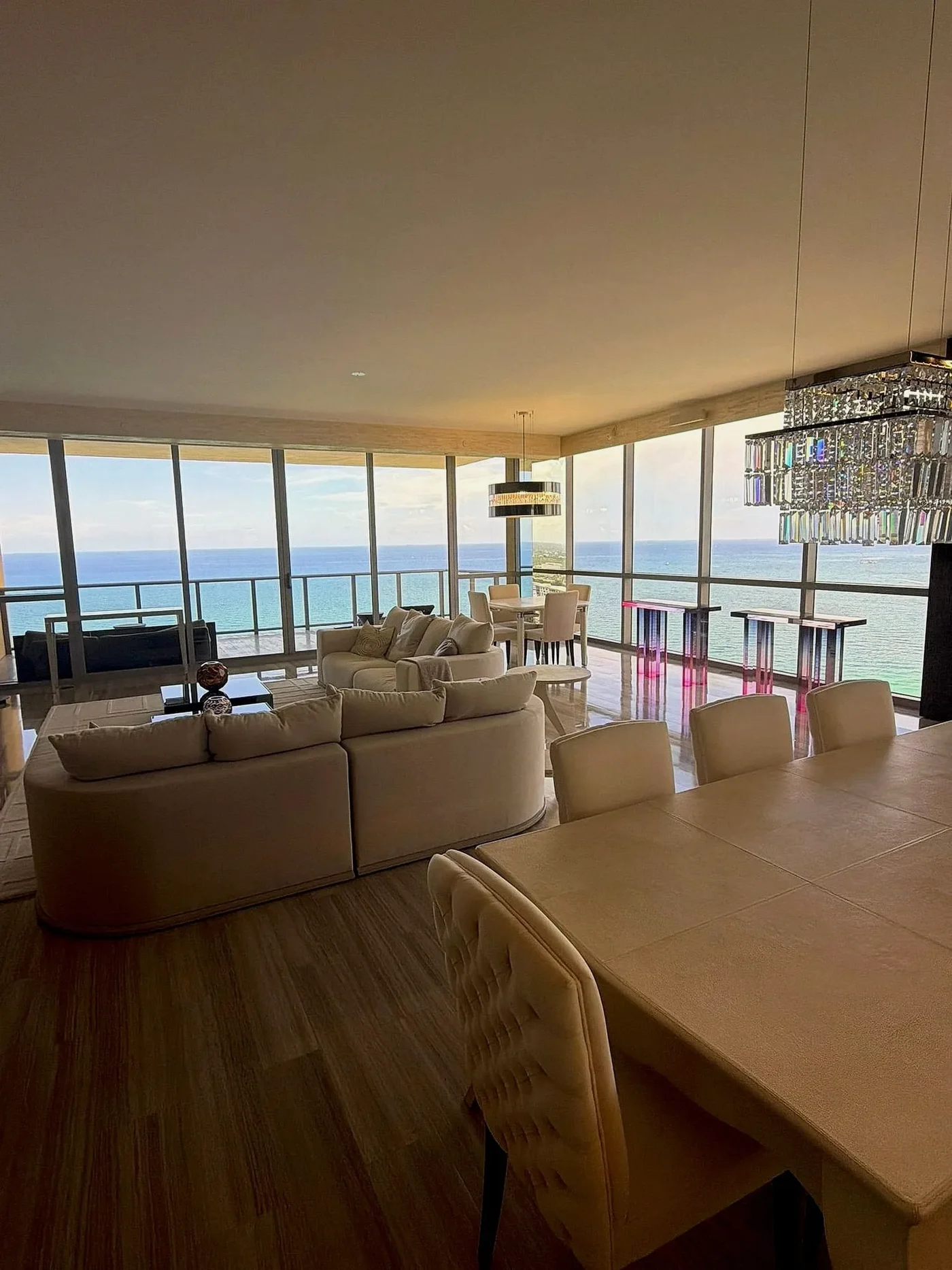 Open-plan living room beside a dining table