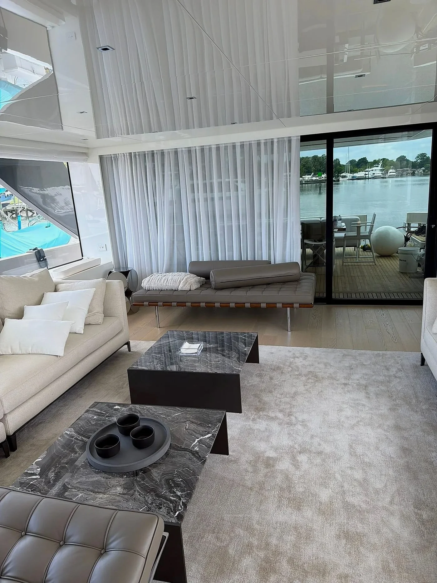 Living room with full-height curtains and seating