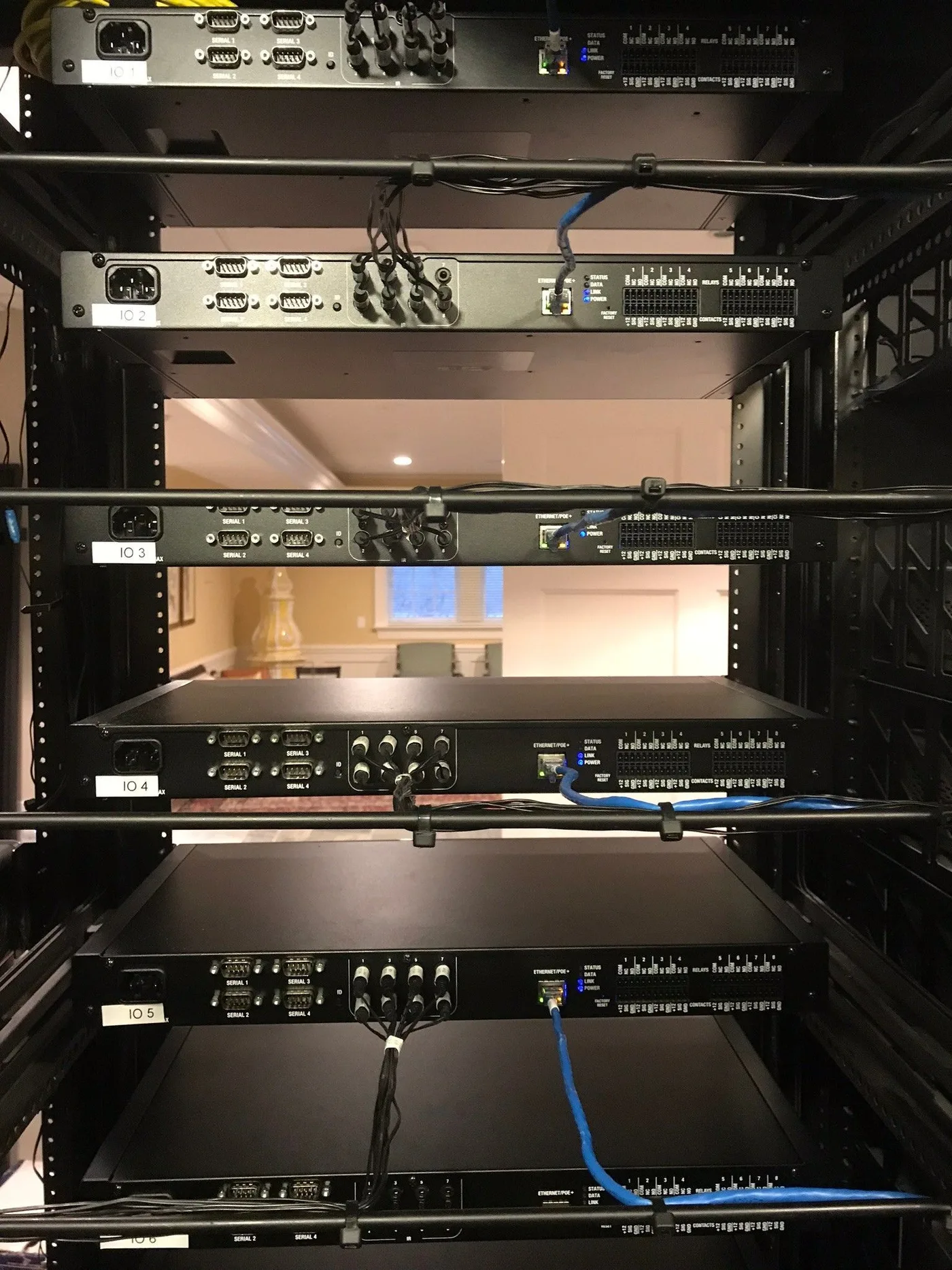 Control processors with cabling secured along rear rack support bars