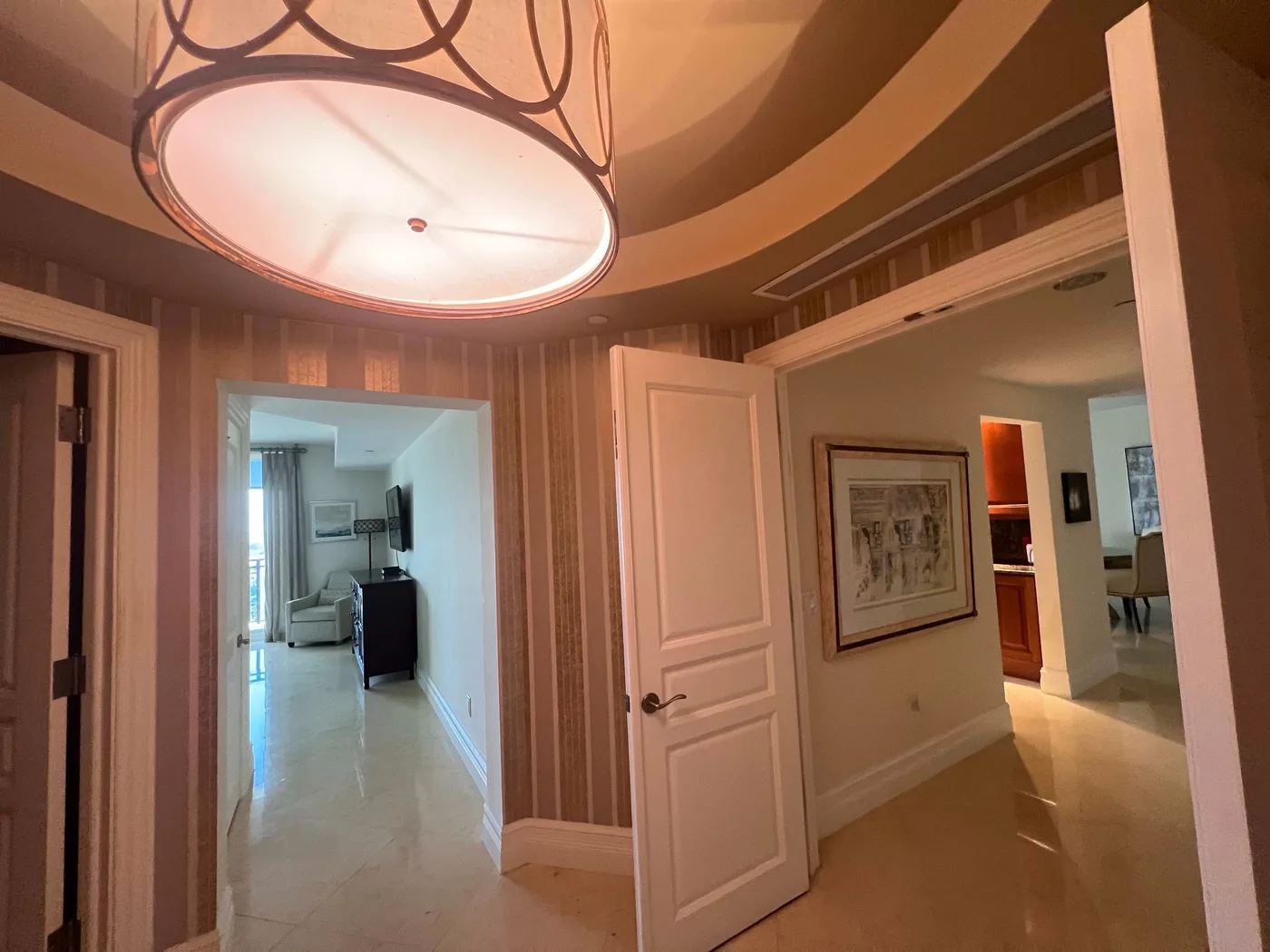 Warm ceiling lighting in a finished residential foyer