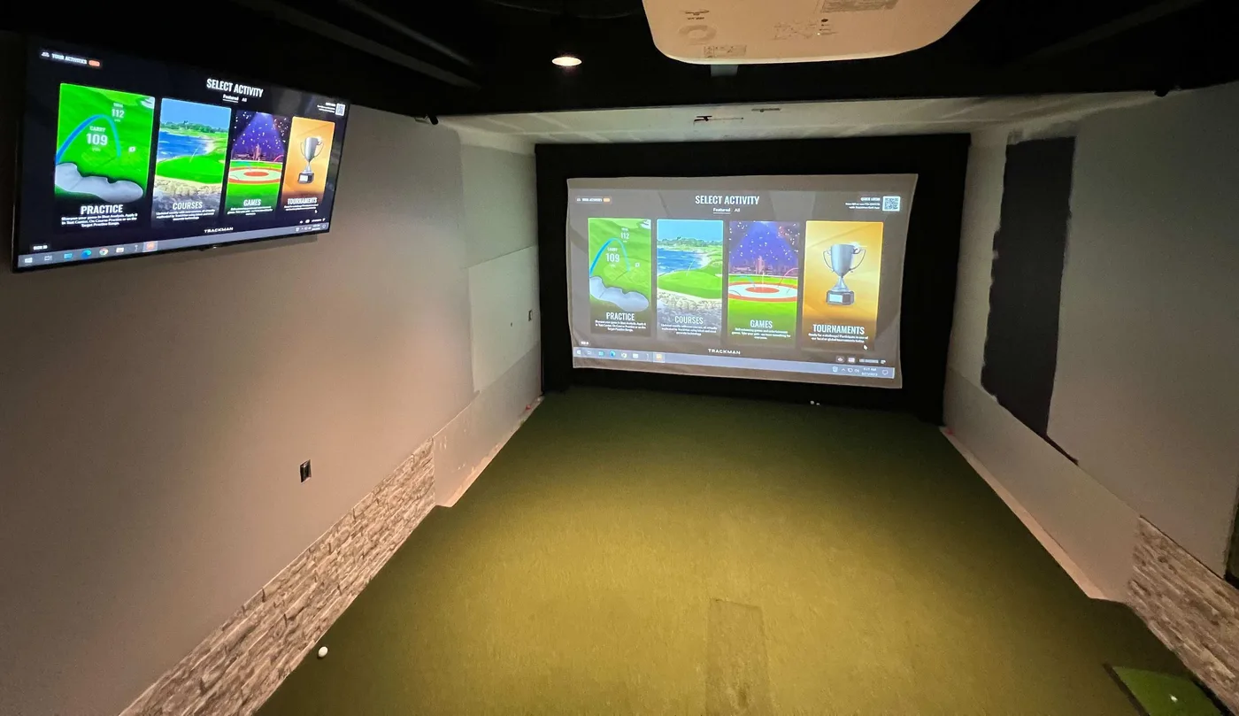 Golf simulator with an active projected interface and a secondary display
