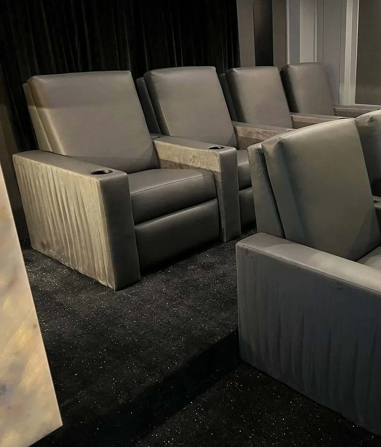 Reclining seats in a finished dedicated theater