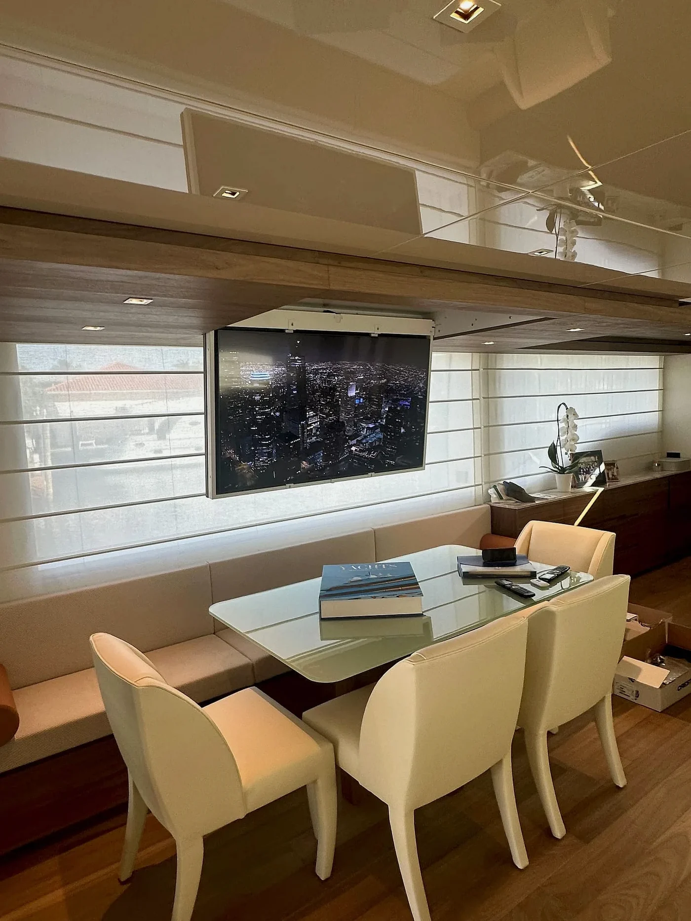 Yacht dining area with an installed display